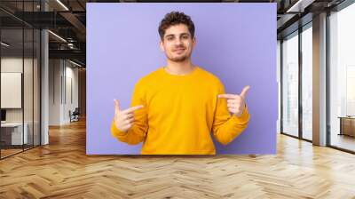 Caucasian man isolated on purple background proud and self-satisfied Wall mural