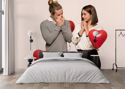 Couple in valentine day smiling a lot over isolated background Wall mural