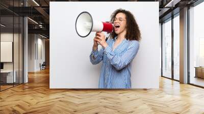 Dominican woman with striped shirt shouting through a megaphone Wall mural