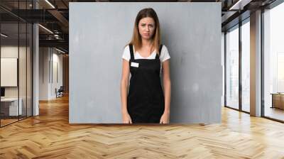 Employee woman with sad and depressed expression Wall mural