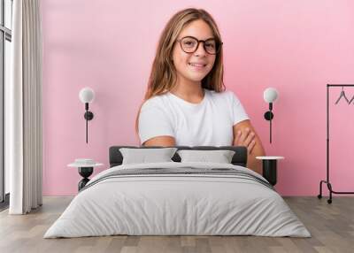 Little caucasian girl isolated on pink background With glasses with happy expression Wall mural