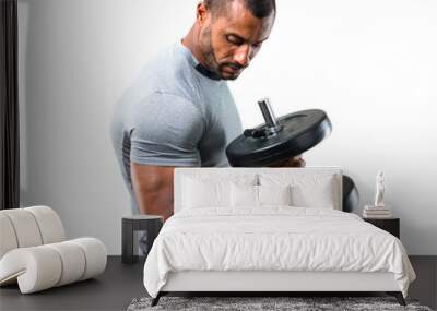 Strong handsome sport man making weightlifting and exercising the biceps on isolated white background Wall mural