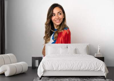 Super Hero woman over isolated white background with arms crossed and happy Wall mural