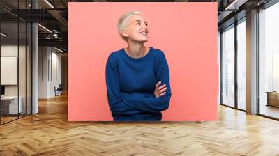 Teenager girl with white short hair over pink wall happy and smiling Wall mural