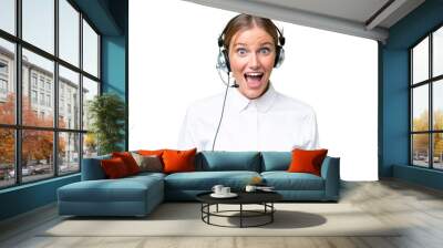 Telemarketer caucasian woman working with a headset over isolated background with surprise and shocked facial expression Wall mural