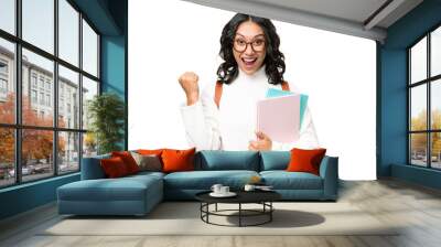 Young Argentinian student woman over isolated background celebrating a victory in winner position Wall mural