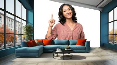 Young Argentinian woman over isolated background showing and lifting a finger in sign of the best Wall mural