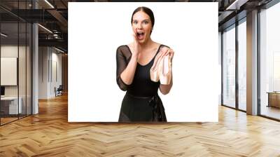 Young caucasian woman practicing ballet over isolated background with surprise and shocked facial expression Wall mural