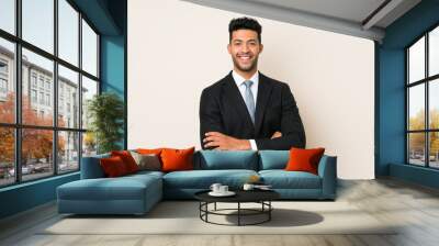 Young handsome businessman man over isolated background laughing Wall mural