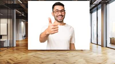 Young handsome caucasian man over isolated chroma key background with thumbs up because something good has happened Wall mural