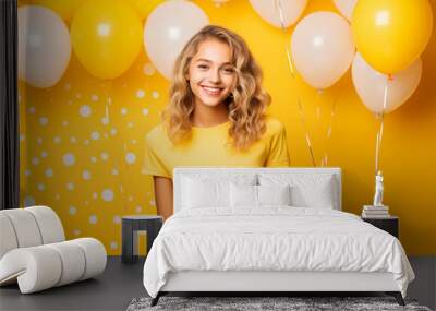 Young pretty blonde girl over isolated colorful background in a birthday party Wall mural