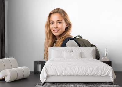 Young pretty blonde girl over isolated white background with mountaineer backpack Wall mural