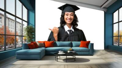 Young university graduate Argentinian woman over isolated background pointing to the side to present a product Wall mural