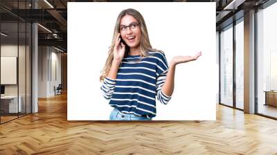 Young Uruguayan woman over isolated background keeping a conversation with the mobile phone with someone Wall mural