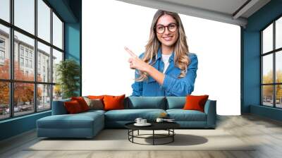 Young Uruguayan woman over isolated background pointing to the side to present a product Wall mural