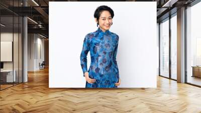 Young Vietnamese woman with short hair wearing a traditional dress over isolated white background laughing Wall mural