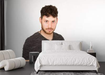 portrait isolated caucasian young man with serious expression Wall mural