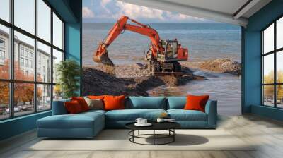  Large tracked excavator digging and cleaning channel at the coast Wall mural