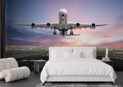 Airplane taking off from the airport runway, front view Wall mural