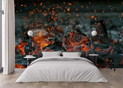 barbecue grill pit with glowing and flaming hot charcoal briquettes, close-up Wall mural