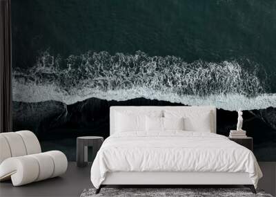 Beautiful aerial view of black beach. Sea ocean waves reaching shore. Wall mural