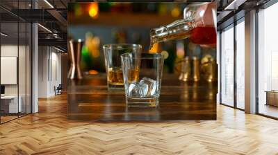 Close-up of pouring whiskey or rum in a pub Wall mural