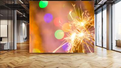 Colorful sparkler, close-up. Wall mural