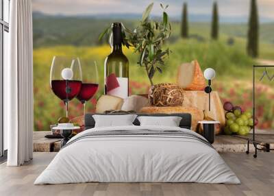 Delicious cheeses with wine on old wooden table. Wall mural