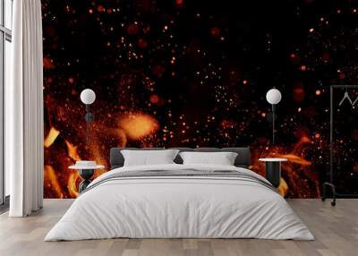 fire flames with sparks on a black background, close-up Wall mural