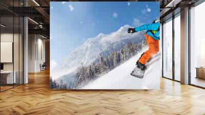 Man snowboarder riding on slope. Wall mural