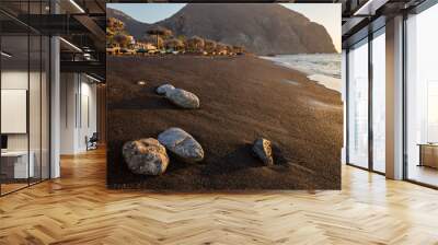 Perissa beach during sunrise on the Greek island of Santorini. Wall mural