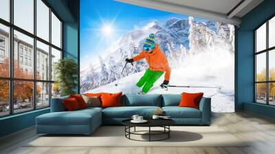 Skier skiing downhill in high mountains Wall mural