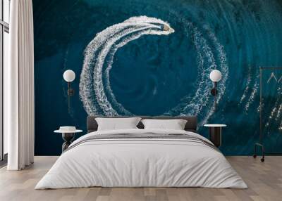 Speed boat in mediterranean sea making a cyrcle from bubbles, aerial view Wall mural