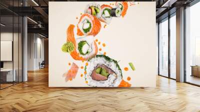 Sushi pieces placed between chopsticks, separated on white background. Popular sushi food. Very high resolution image Wall mural