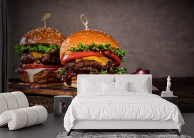 Tasty burgers on wooden table. Wall mural