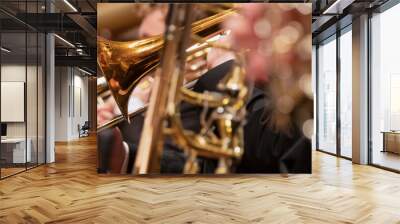 Trumpet professional player with symphony orchestra performing in concert on background. Wall mural