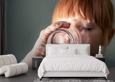 Little girl drinking a fresh glass of water Wall mural