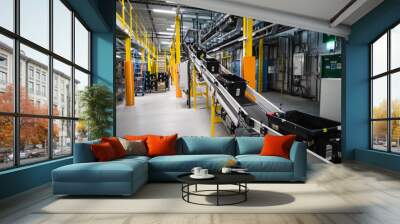 conveyor belt in the Warehouse with black totes with goods inside Wall mural