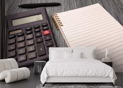 Empty notepad with a pen and calculator mock-up accounting economy concept doing taxes writing diary Wall mural