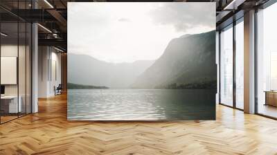 Misty sunrise above the Bohinj lake, Slovenia. Julian Alps in background. Beautiful Slovenian lake with turquoise water in triglav national park.  Wall mural