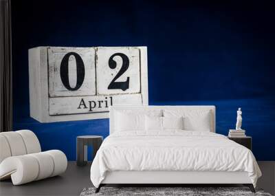 April 2nd, Second of April, Day 2 of month April - rustic wooden white calendar blocks on dark blue background with empty space for text. Wall mural