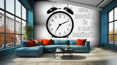 Every morning is a new beginning phrase on background with black vintage alarm clock. Bright bokeh background with copy space. Wall mural