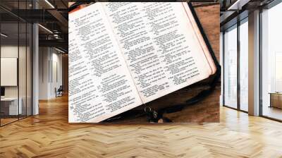 Holy Bible isolated on old vintage wooden table Wall mural