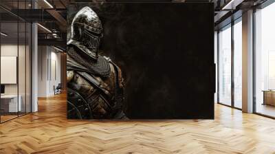 An armored knight holding a sharp sword, ready for battle and wearing protective gear Wall mural