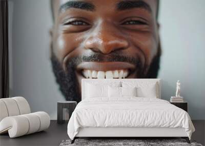 Closeup of a smiling man showcasing happiness and excitement for a web developer position, with a blurred background reflecting aspirations and creativity Wall mural