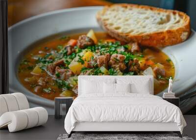 Healthy and Tasty Vegetable and Meat Soup Served with Bread on a White Plate Wall mural