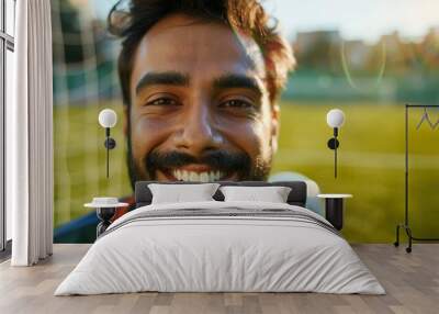 Portrait of a happy soccer player celebrating a sports victory on the field, showcasing the joy and fitness of an athlete after training Wall mural