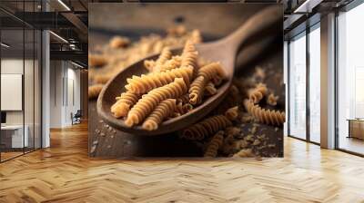 Raw fusilli with a wooden spoon on the table, in close-up Generative AI Wall mural