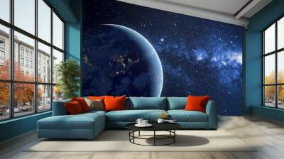 Planet earth planet in deep space against blue nebula. Night view from the orbit of the planet with cities lights. Elements of this image furnished by NASA. Wall mural