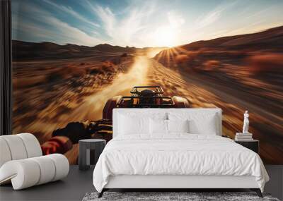 Atv desert ride at sunset. First person view of an ATV driving fast through the desert as the sun sets, kicking up dust. Wall mural